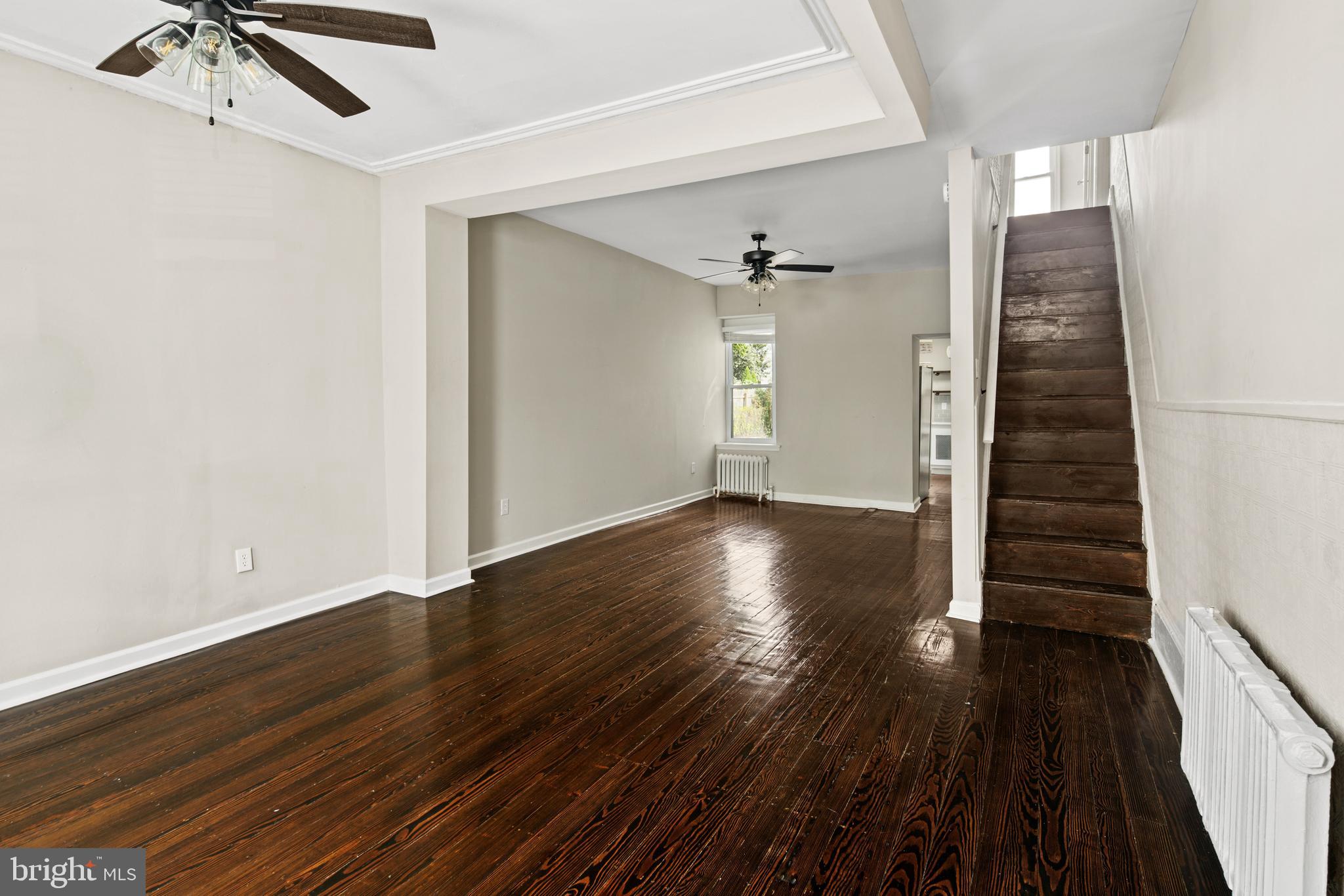 127 Seville Street Philadelphia, PA 19127 - Photo 6 of 23 wooden floor in an empty room with a window
