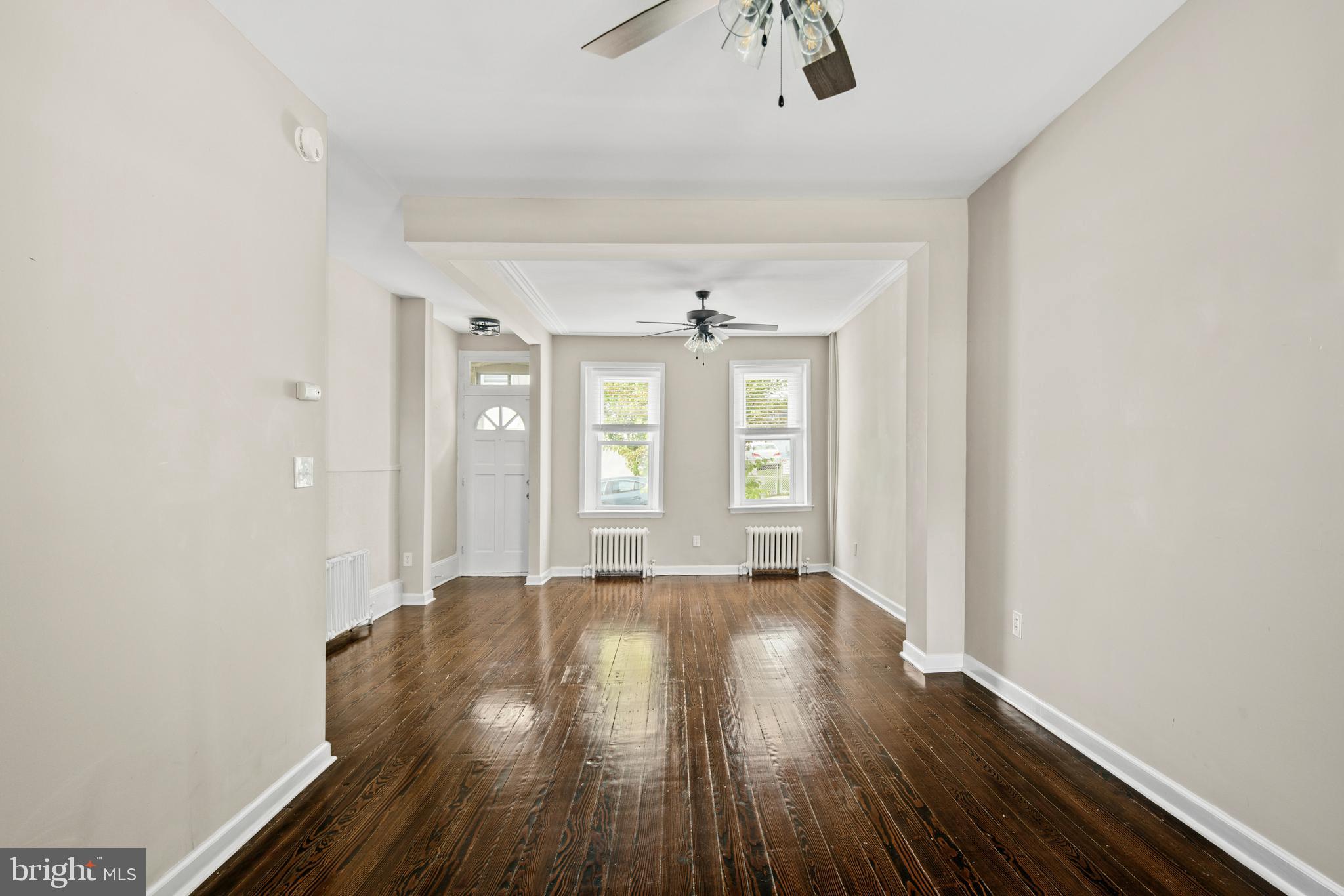 127 Seville Street Philadelphia, PA 19127 - Photo 7 of 23 a view of an empty room with wooden floor and a window