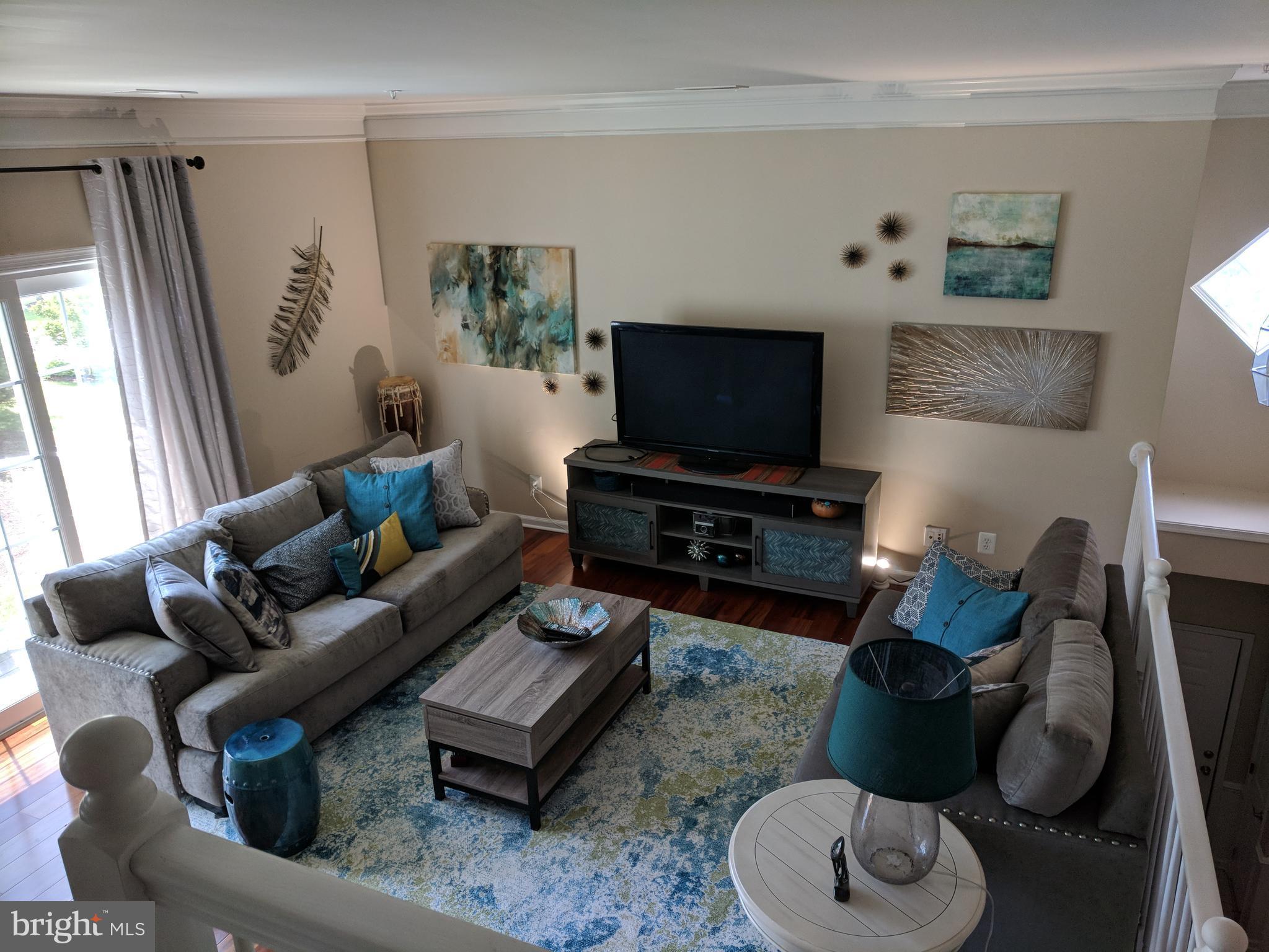 6325 Eagle Ridge Lane, Unit C Alexandria, VA 22312 - Photo 7 of 27 Large family room leading out to Trex balcony