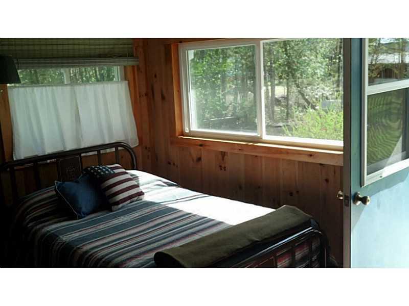 102 Sand Cv Road Princeton, ME 04668 - Photo 8 of 26 Bedroom. Cabin bedroom.