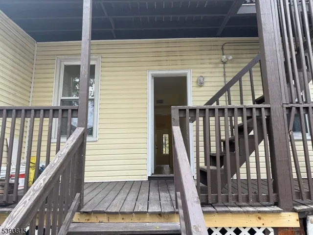 a view of deck with wooden floor and chair