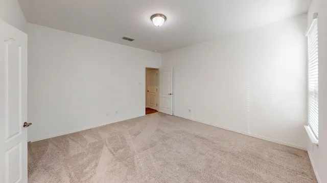 an empty room with an entryway