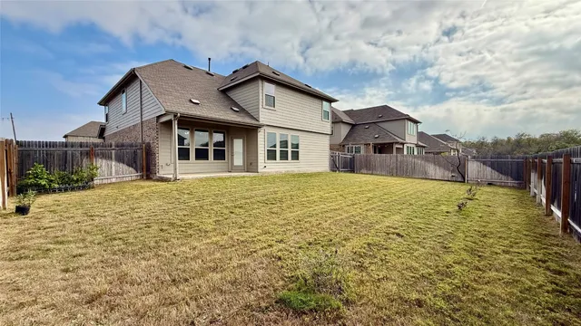 a large house with a large tree in front of it