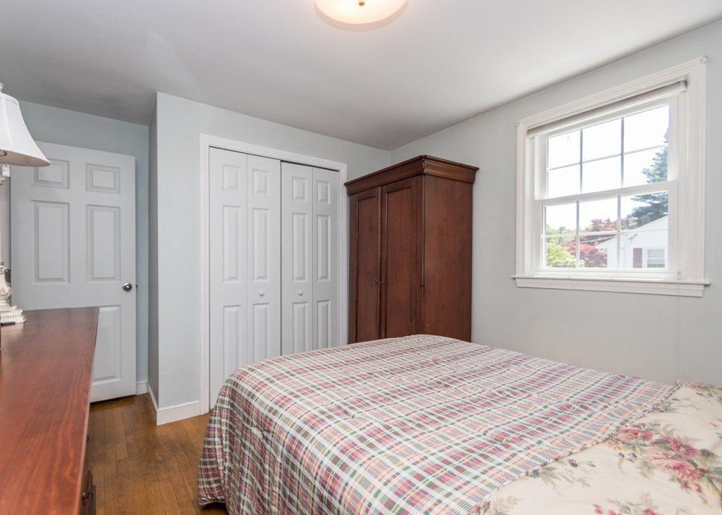 166 Totten Pond Road Waltham, MA 02451 - Photo 11 of 29 a bedroom with a bed and a window