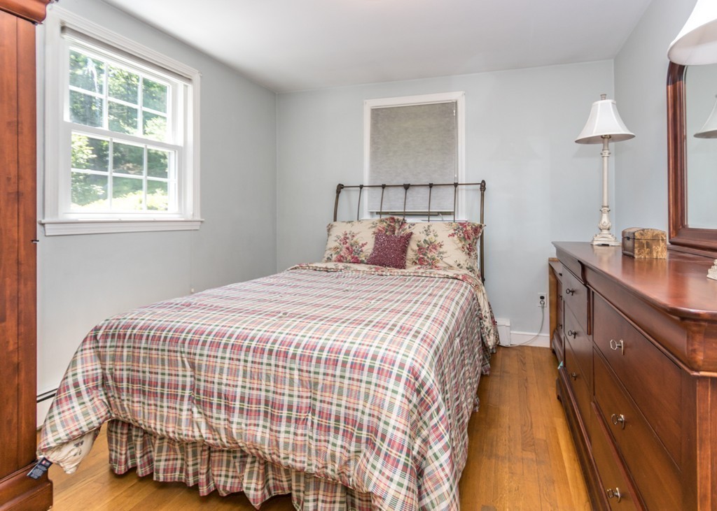 166 Totten Pond Road Waltham, MA 02451 - Photo 13 of 29 a bedroom with a bed and a window