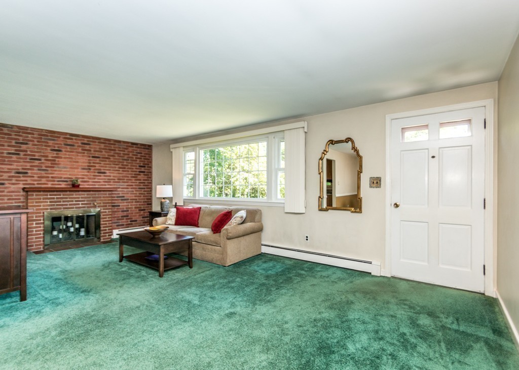 166 Totten Pond Road Waltham, MA 02451 - Photo 8 of 29 a living room with furniture and fireplace
