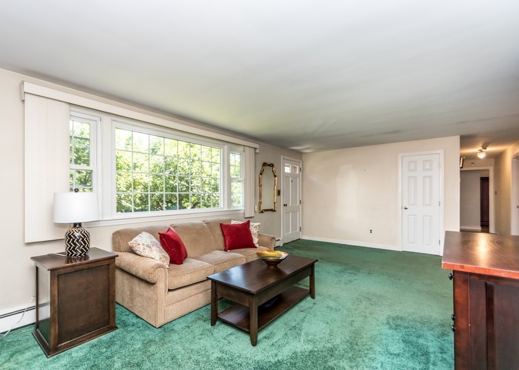 166 Totten Pond Road Waltham, MA 02451 - Photo 9 of 29 a living room with furniture and a large window