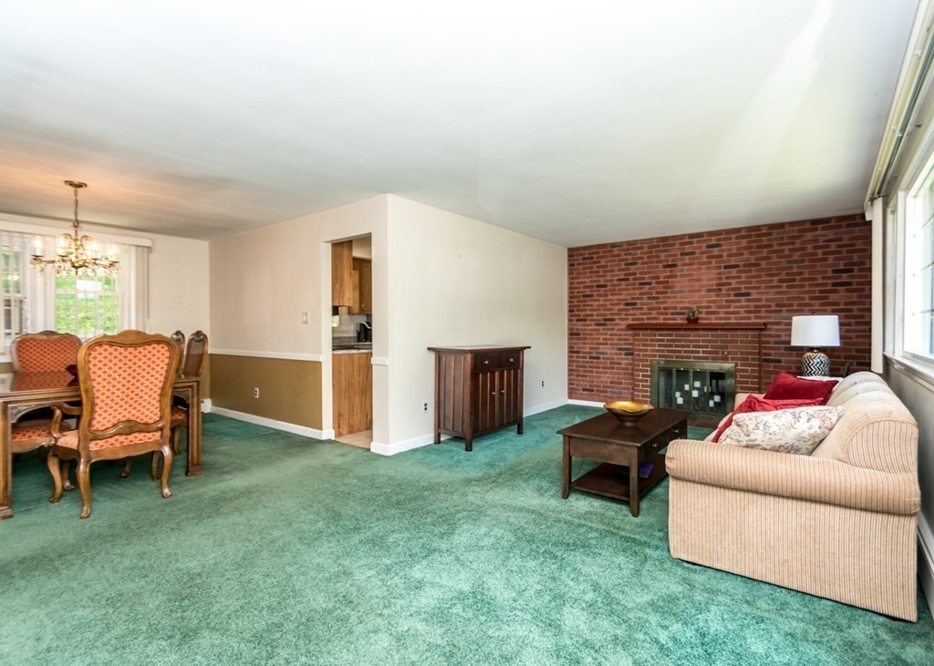 166 Totten Pond Road Waltham, MA 02451 - Photo 10 of 29 a living room with furniture and a fireplace