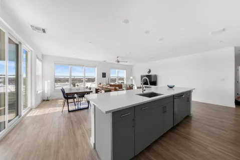 a kitchen with a refrigerator sink and microwave
