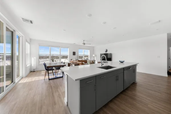 a kitchen with a refrigerator sink and microwave