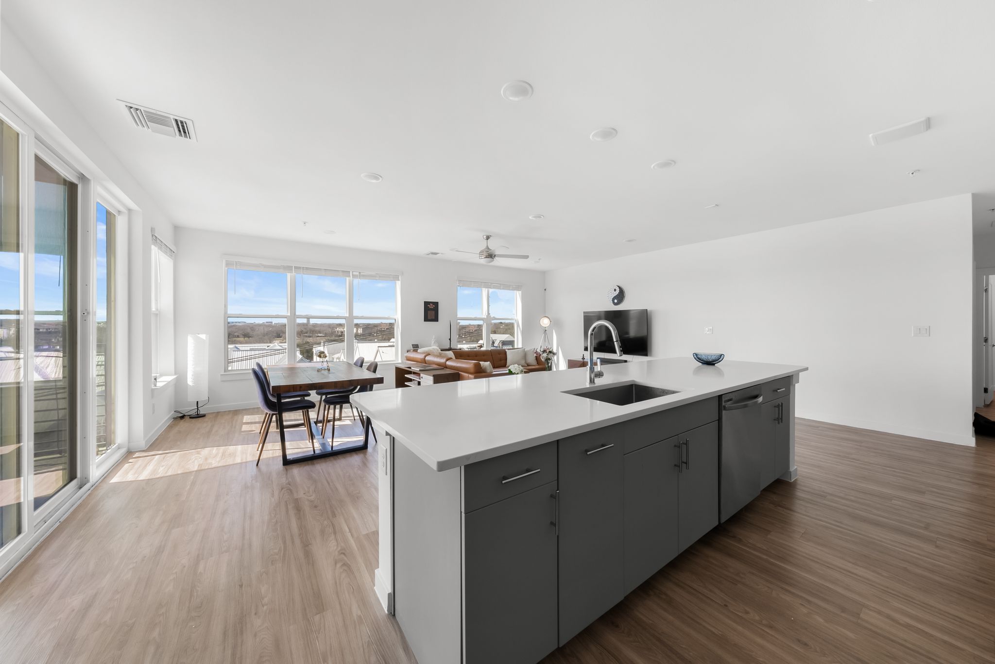4801 Springdale Road, Unit 2410 Austin, TX 78723 - Photo 16 of 33 a kitchen with a sink cabinets and wooden floor