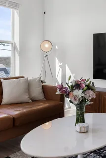 a living room with furniture and a flat screen tv