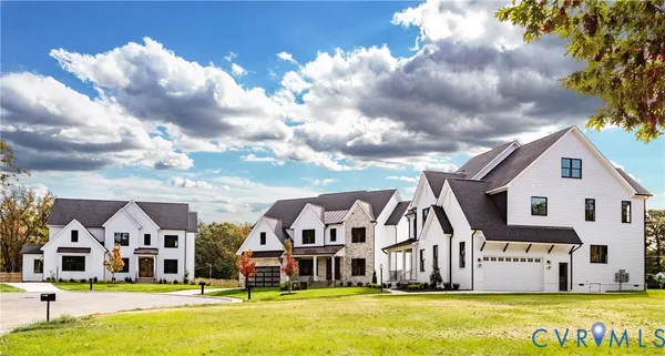 a front view of residential houses with outdoor space and swimming pool