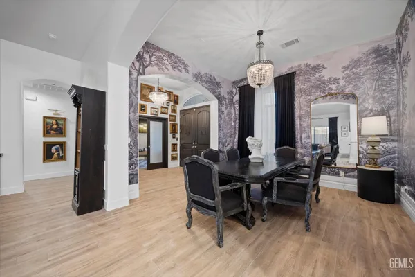 a kitchen with stainless steel appliances a stove and cabinets