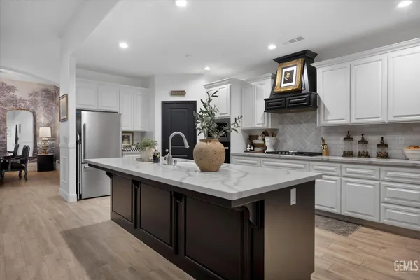 a bedroom with furniture and a large window