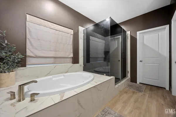 a kitchen with stainless steel appliances granite countertop a refrigerator stove and sink