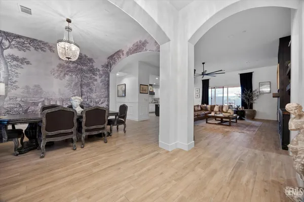 a kitchen with a sink cabinets and refrigerator