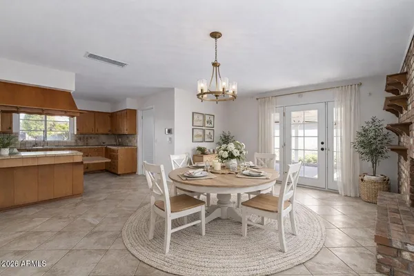 a kitchen with stainless steel appliances granite countertop a stove and a refrigerator