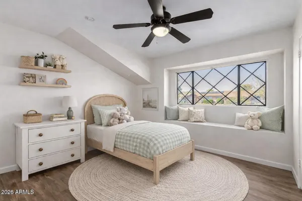 a bathroom with a granite countertop sink a toilet and shower