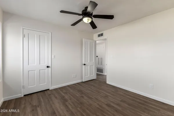 a view of a house with backyard sitting area and garden