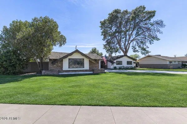 a aerial view of a house with a yard