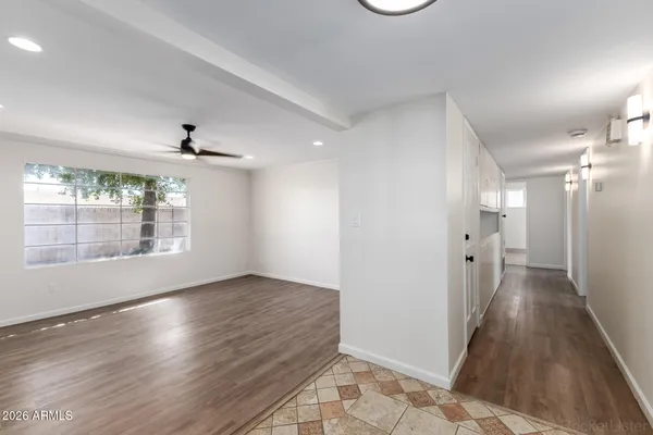 a view of a kitchen with a sink and dishwasher cabinets