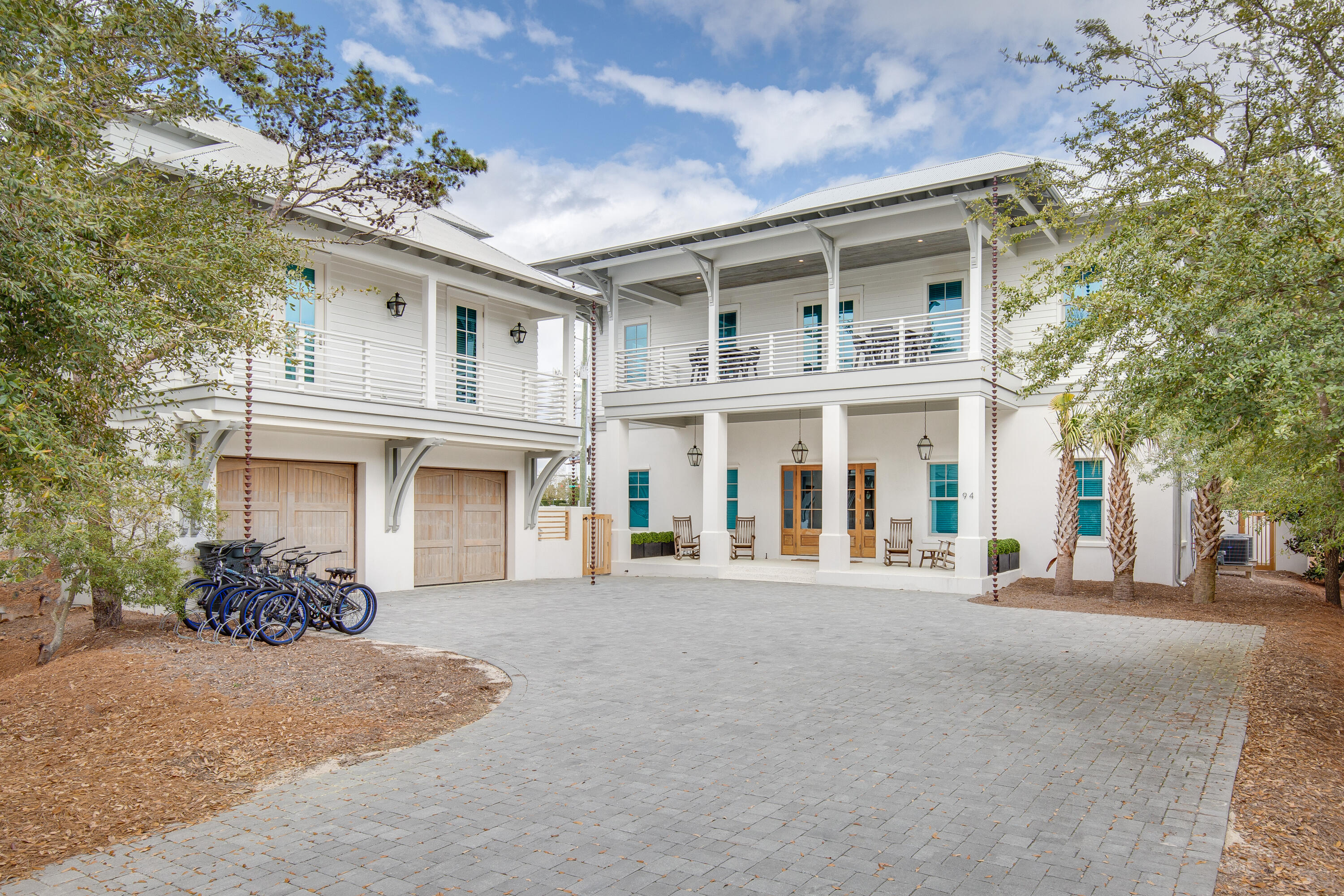 a front view of a building with a garden
