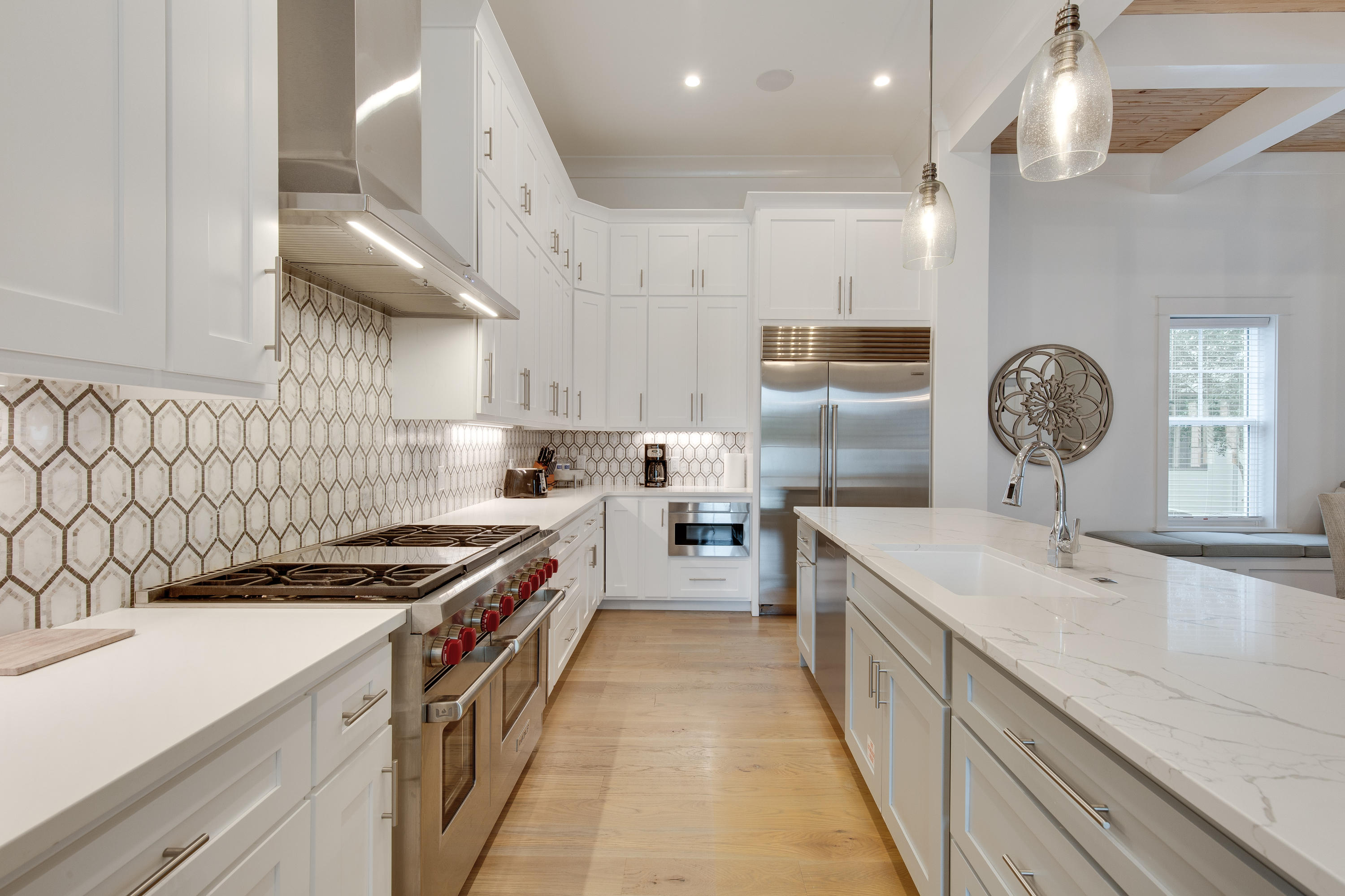 94 Pine Crest Circle Rosemary Beach, FL 32461 - Photo 16 of 69 a kitchen with kitchen island a counter space a sink and a stove