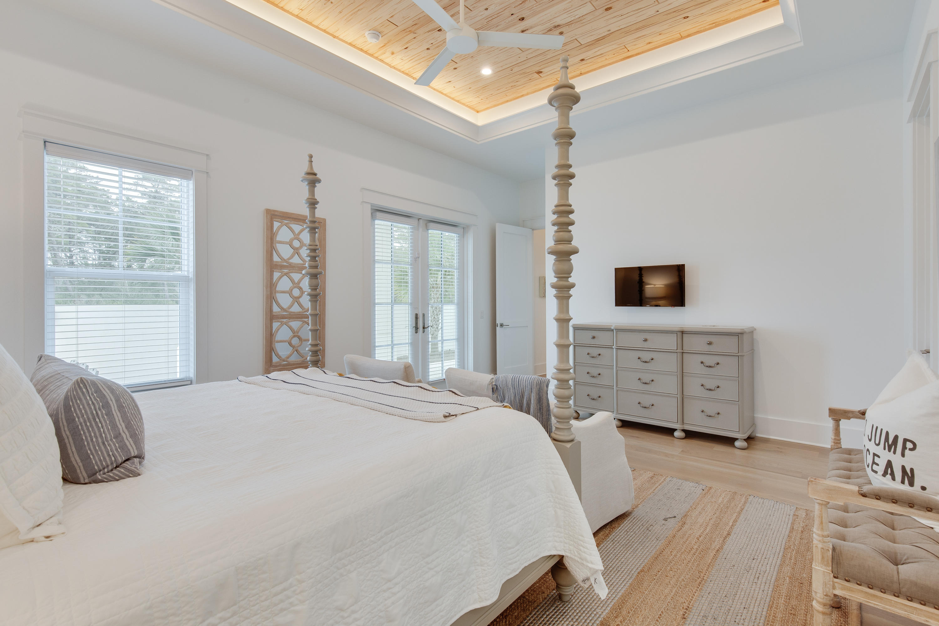 94 Pine Crest Circle Rosemary Beach, FL 32461 - Photo 19 of 69 a bedroom with a bed dresser and a flat tv screen