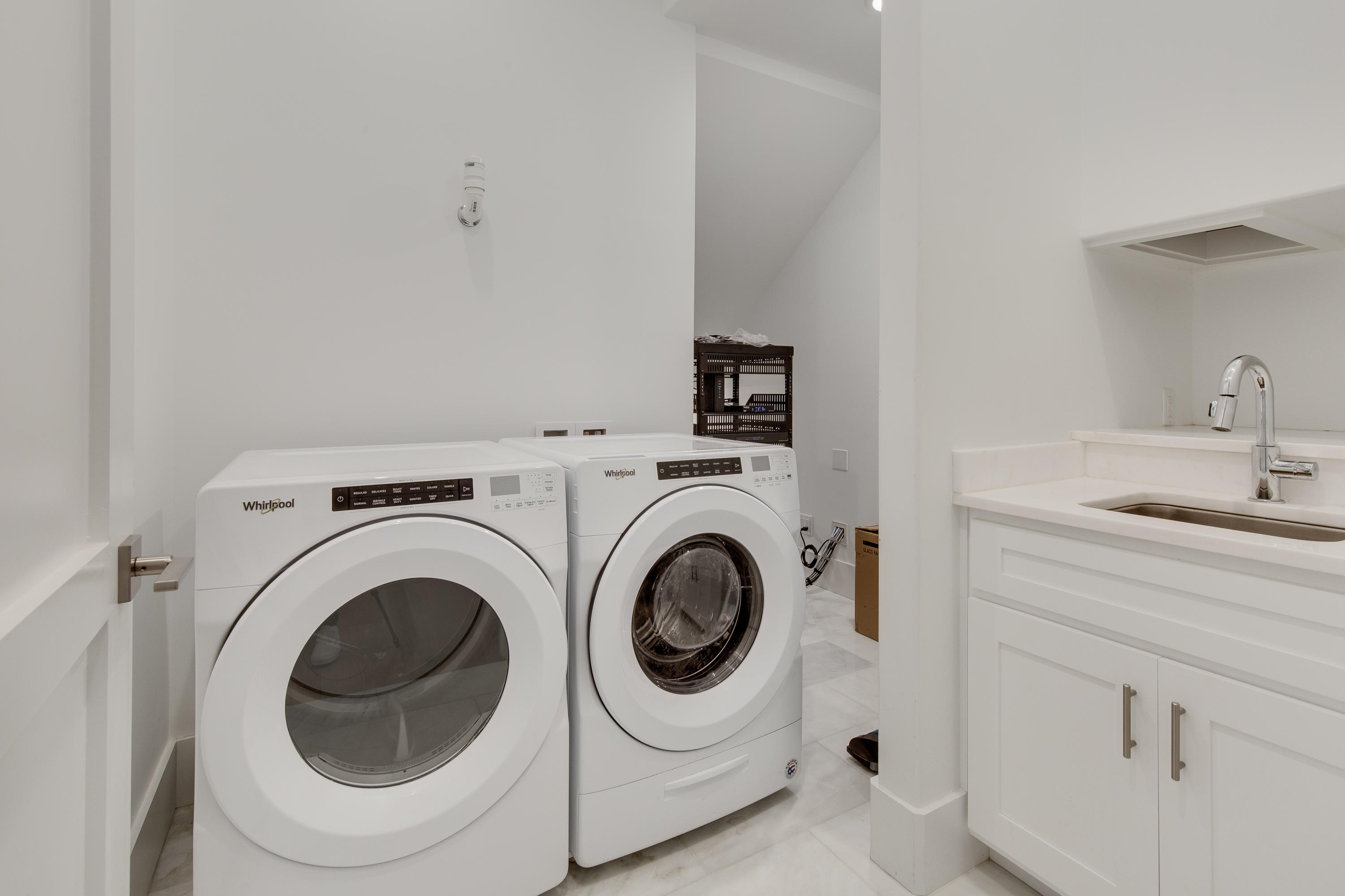 94 Pine Crest Circle Rosemary Beach, FL 32461 - Photo 21 of 69 a utility room with sink dryer and washer