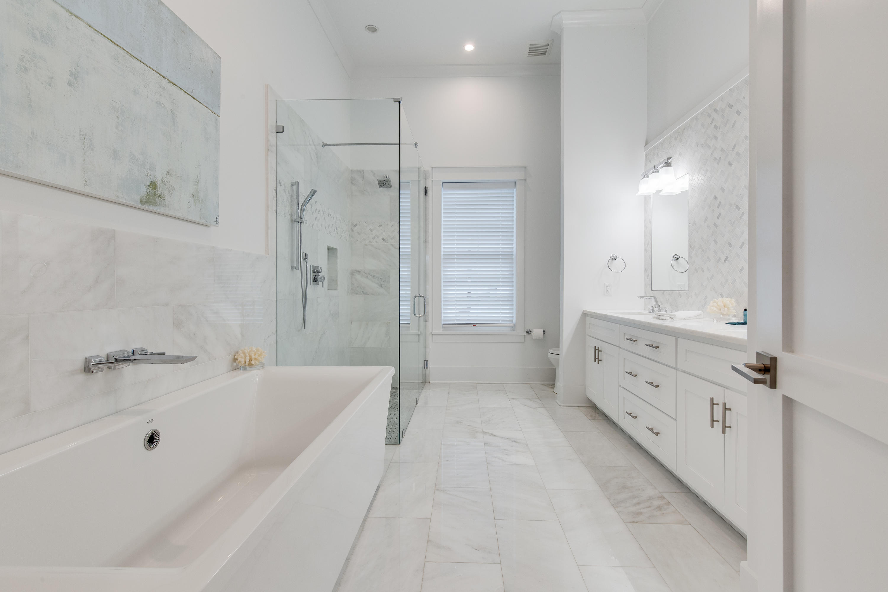 94 Pine Crest Circle Rosemary Beach, FL 32461 - Photo 22 of 69 a bathroom with a bathtub and a double vanity sink shower