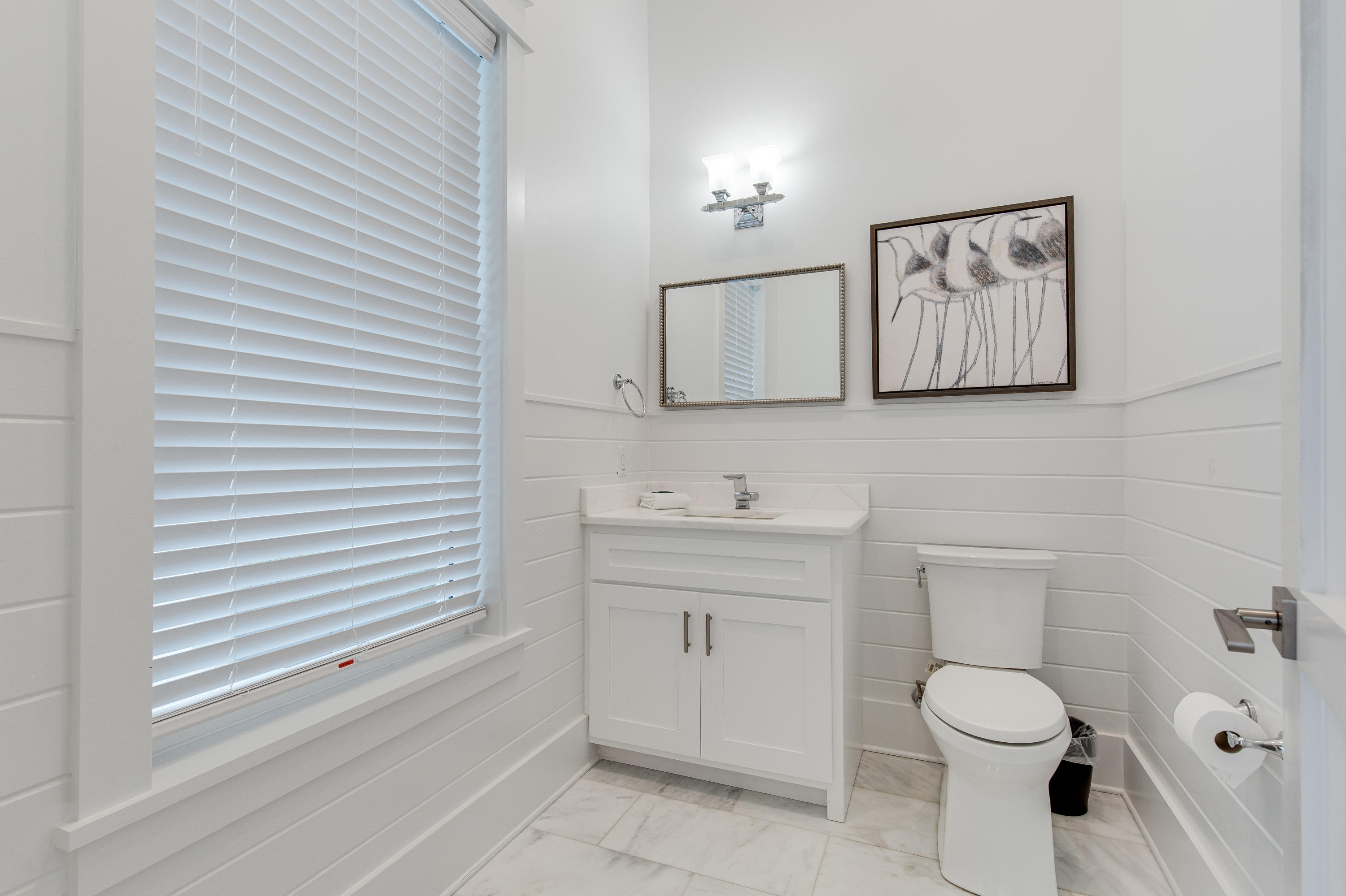 94 Pine Crest Circle Rosemary Beach, FL 32461 - Photo 24 of 69 a bathroom with a toilet sink and mirror