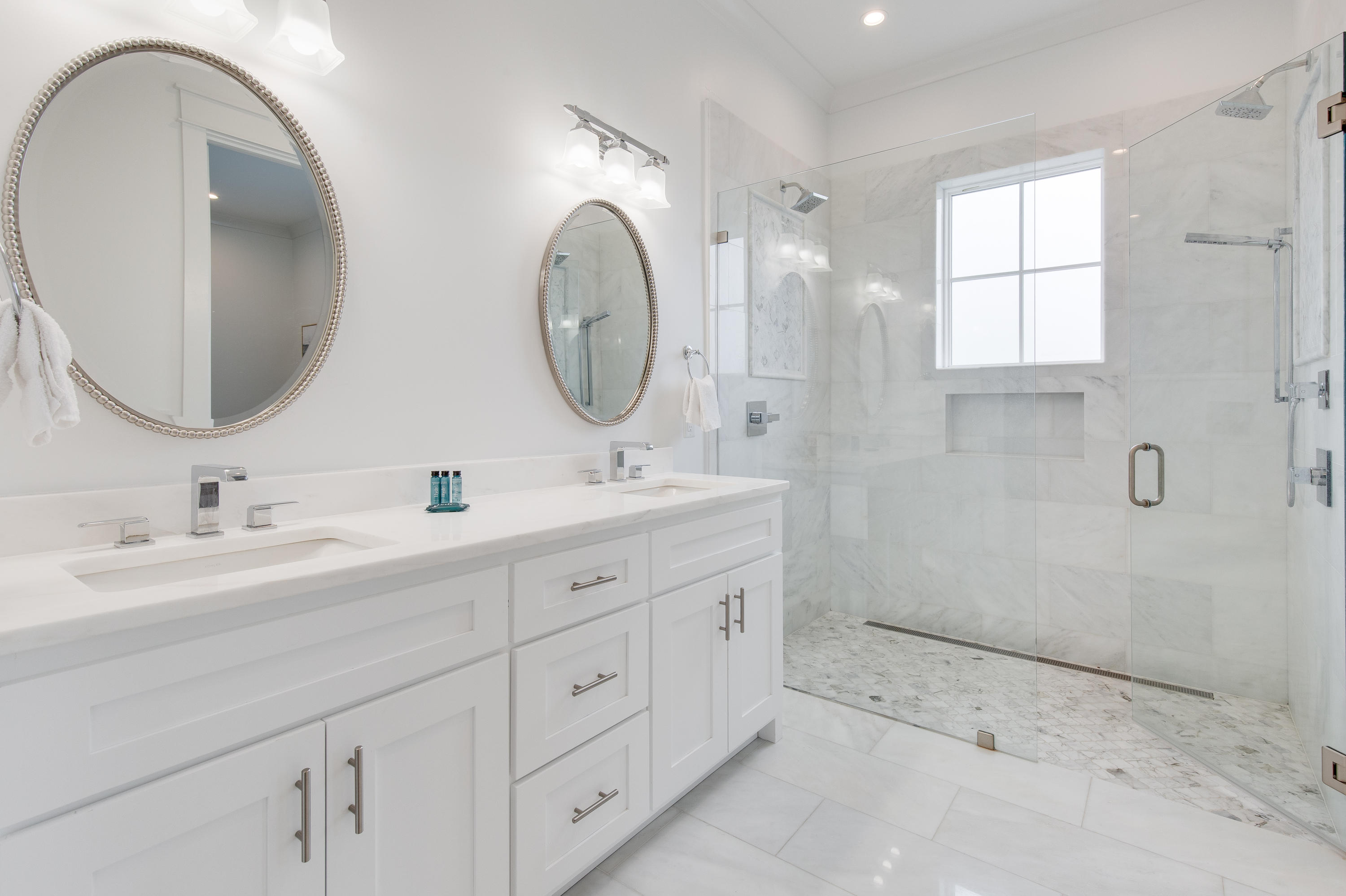 94 Pine Crest Circle Rosemary Beach, FL 32461 - Photo 30 of 69 a bathroom with a double vanity sink and a mirror