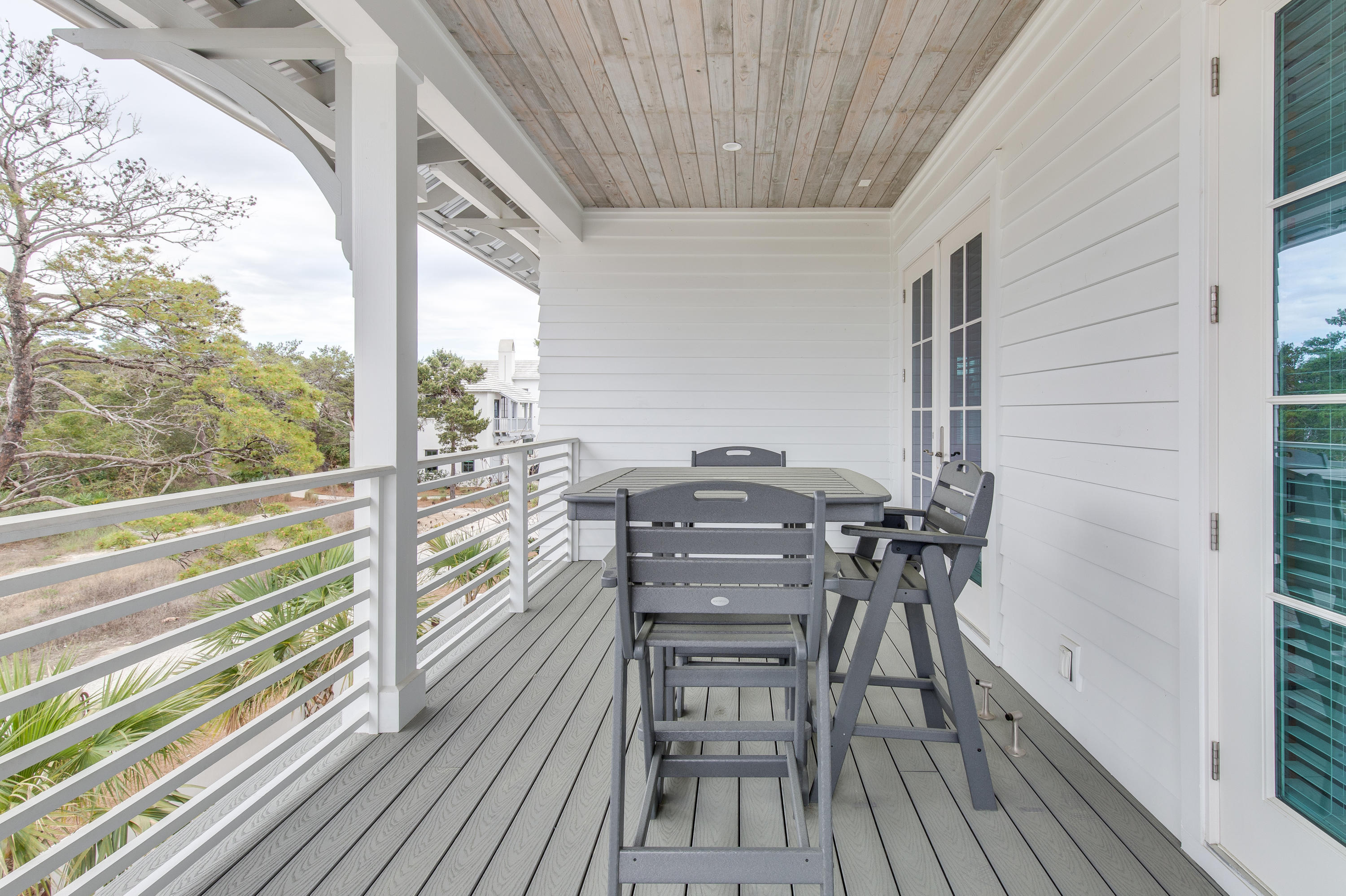 94 Pine Crest Circle Rosemary Beach, FL 32461 - Photo 31 of 69 a view of a balcony with chairs