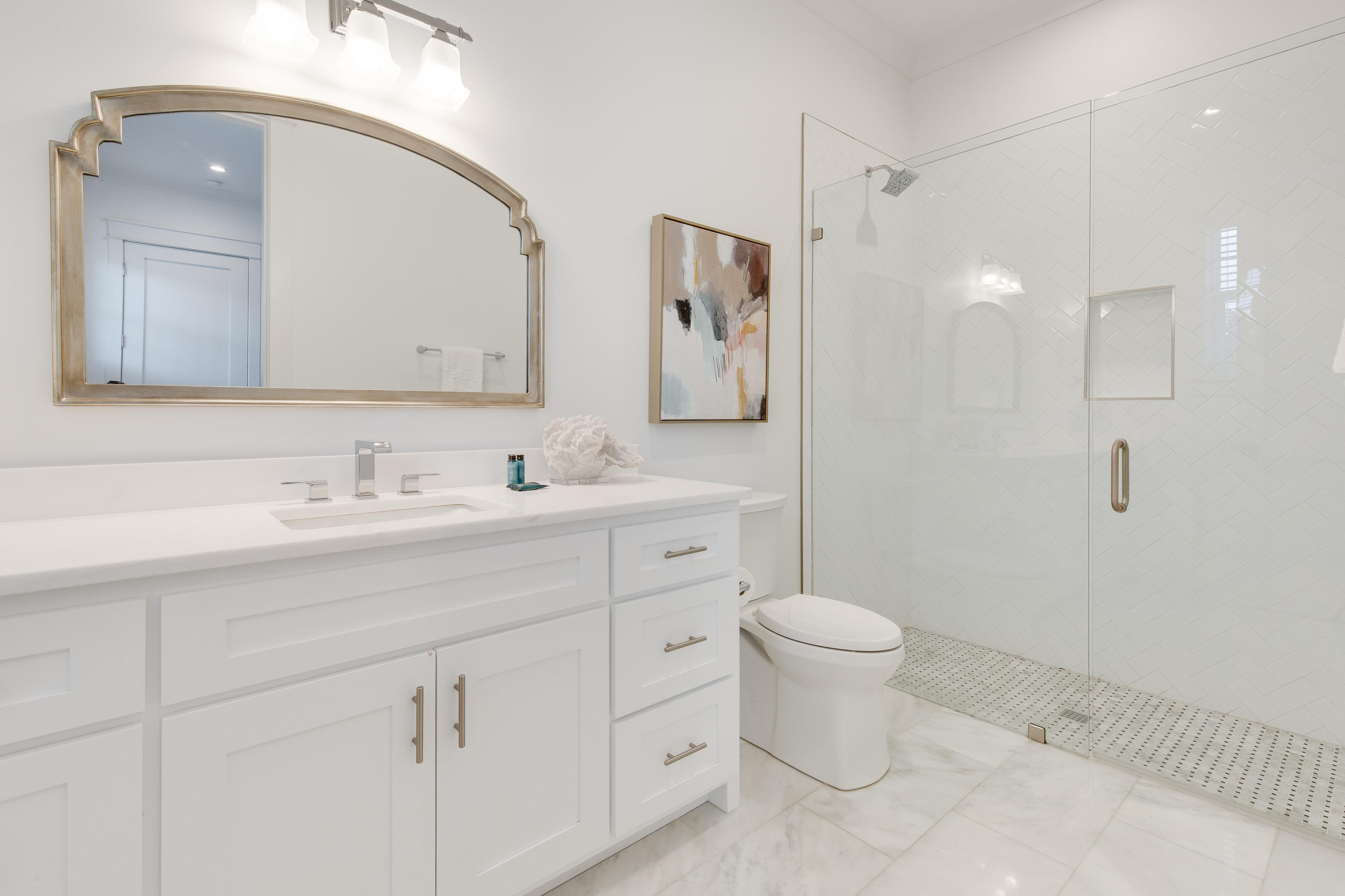 94 Pine Crest Circle Rosemary Beach, FL 32461 - Photo 33 of 69 a bathroom with a toilet sink and mirror