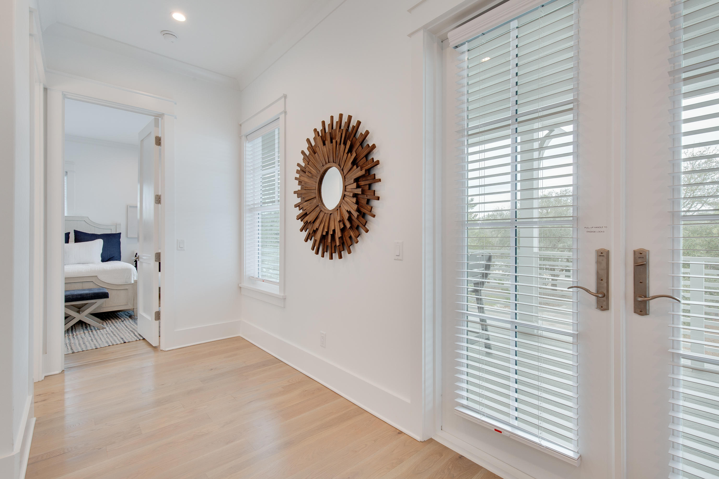 94 Pine Crest Circle Rosemary Beach, FL 32461 - Photo 40 of 69 a very nice looking room with a large window and a hallway