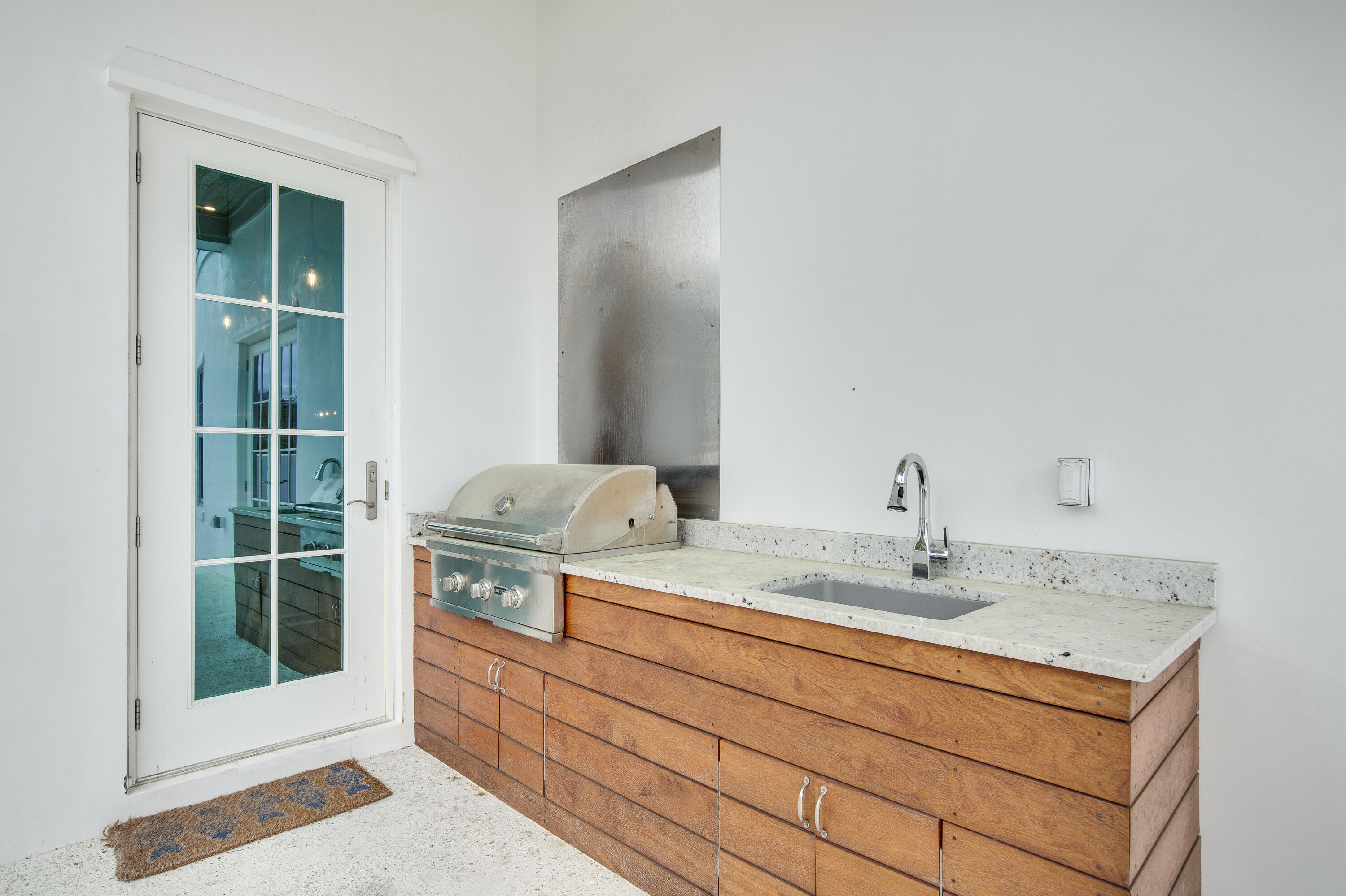 94 Pine Crest Circle Rosemary Beach, FL 32461 - Photo 52 of 69 a bathroom with a granite countertop sink and a mirror
