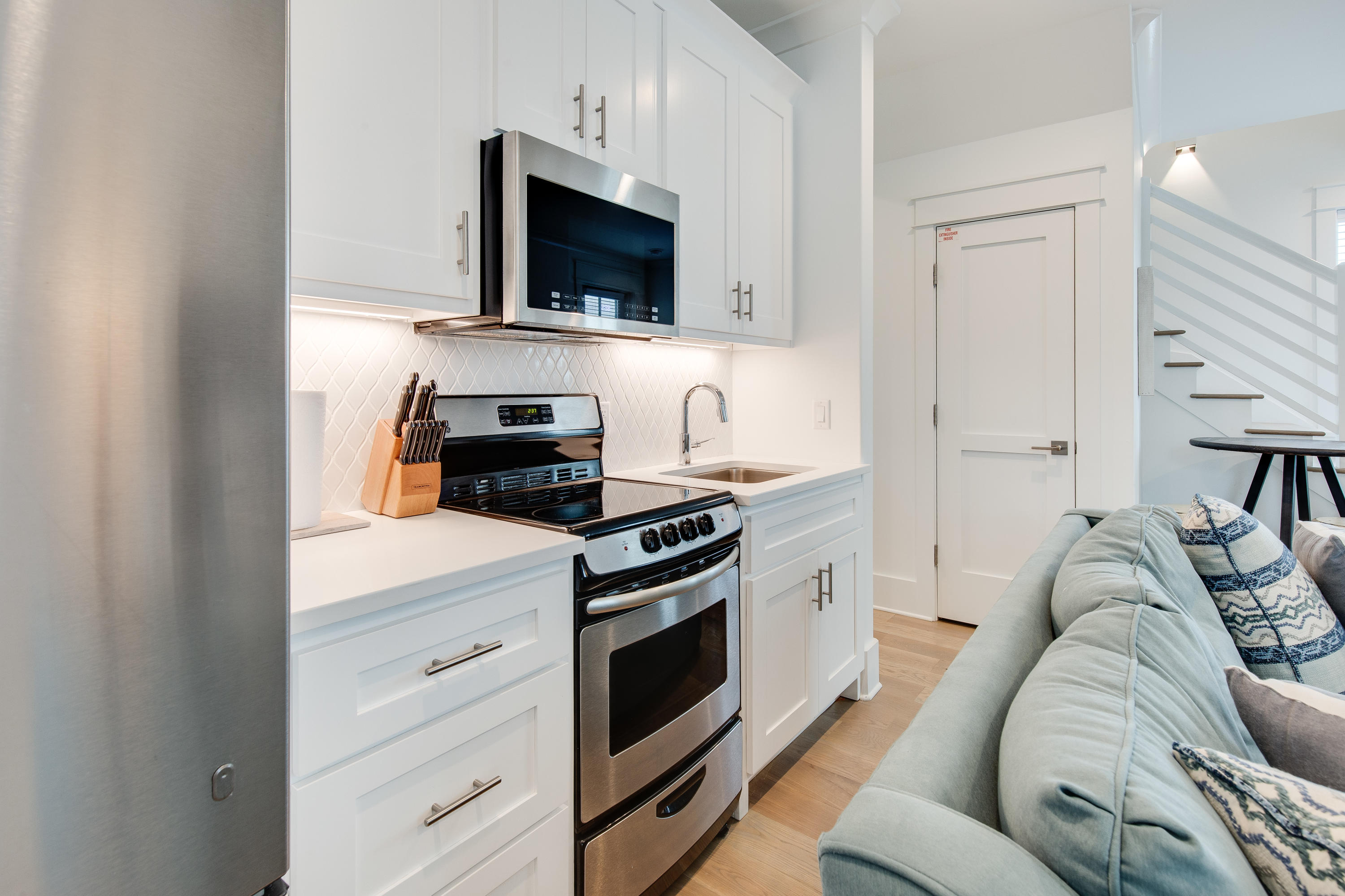 94 Pine Crest Circle Rosemary Beach, FL 32461 - Photo 55 of 69 a living room with furniture and a flat screen tv