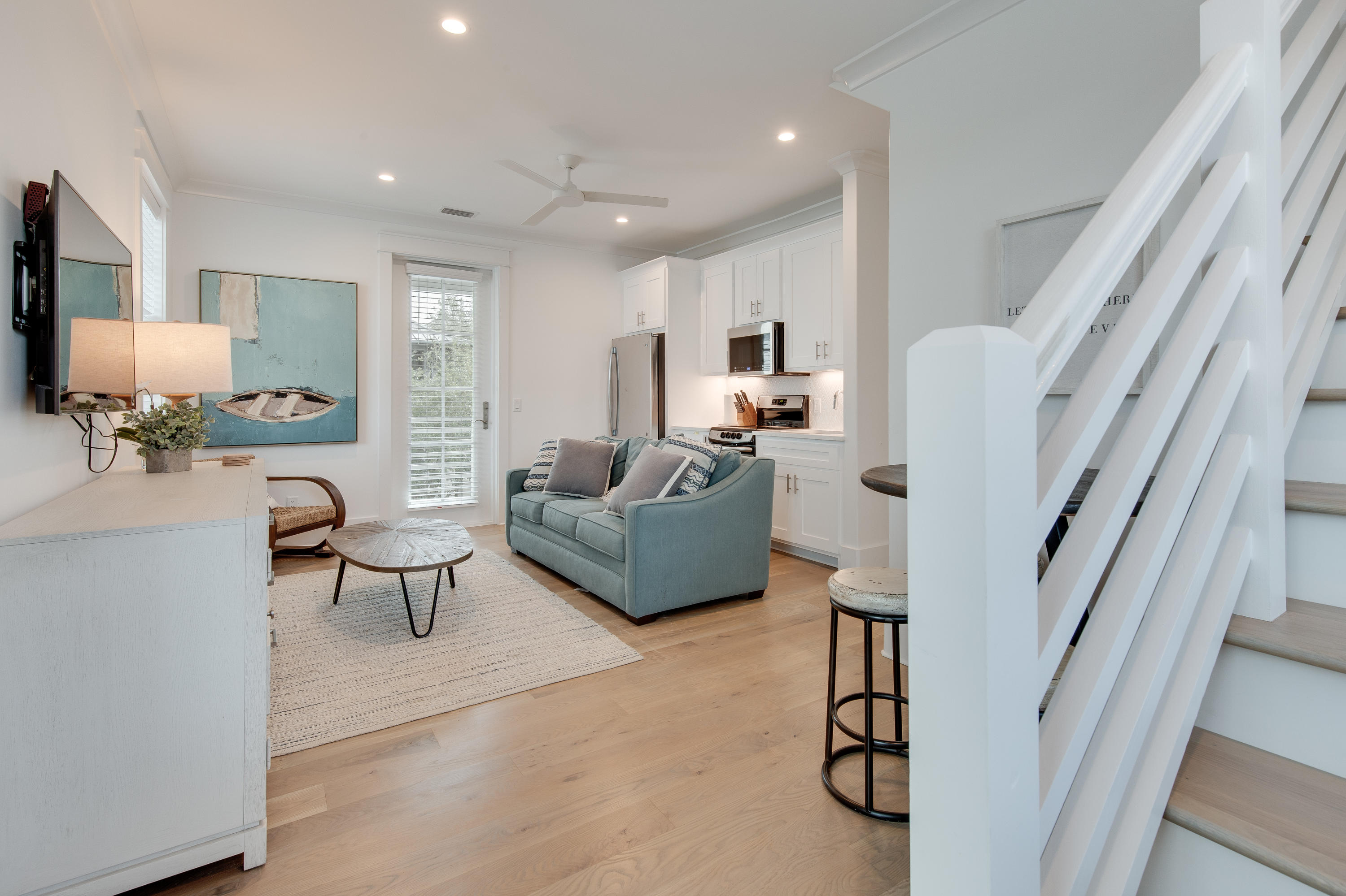 94 Pine Crest Circle Rosemary Beach, FL 32461 - Photo 62 of 69 a living room with furniture a rug and white walls
