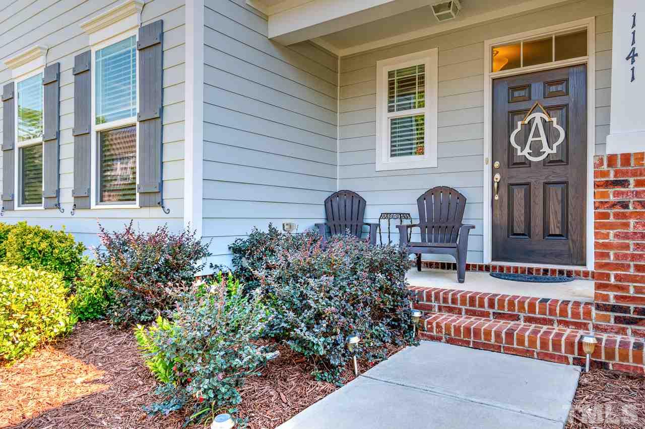 1141 Chapanoke Road Raleigh, NC 27603 - Photo 1 of 25 a front view of multi story residential apartment building with yard and seating space