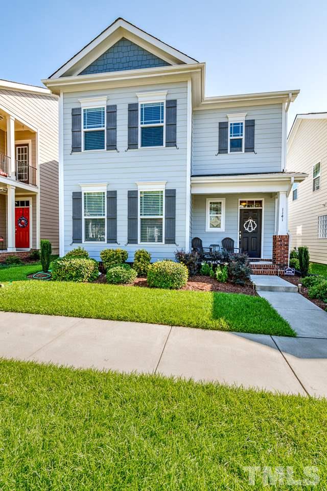 1141 Chapanoke Road Raleigh, NC 27603 - Photo 2 of 25 a front view of a house with a yard and potted plants