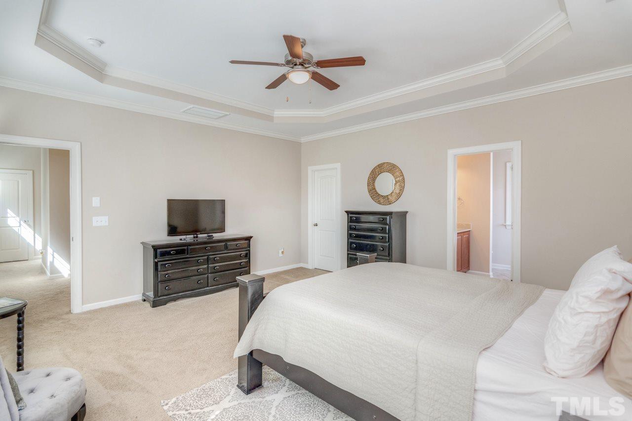 1141 Chapanoke Road Raleigh, NC 27603 - Photo 16 of 25 a bedroom with a bed and a television