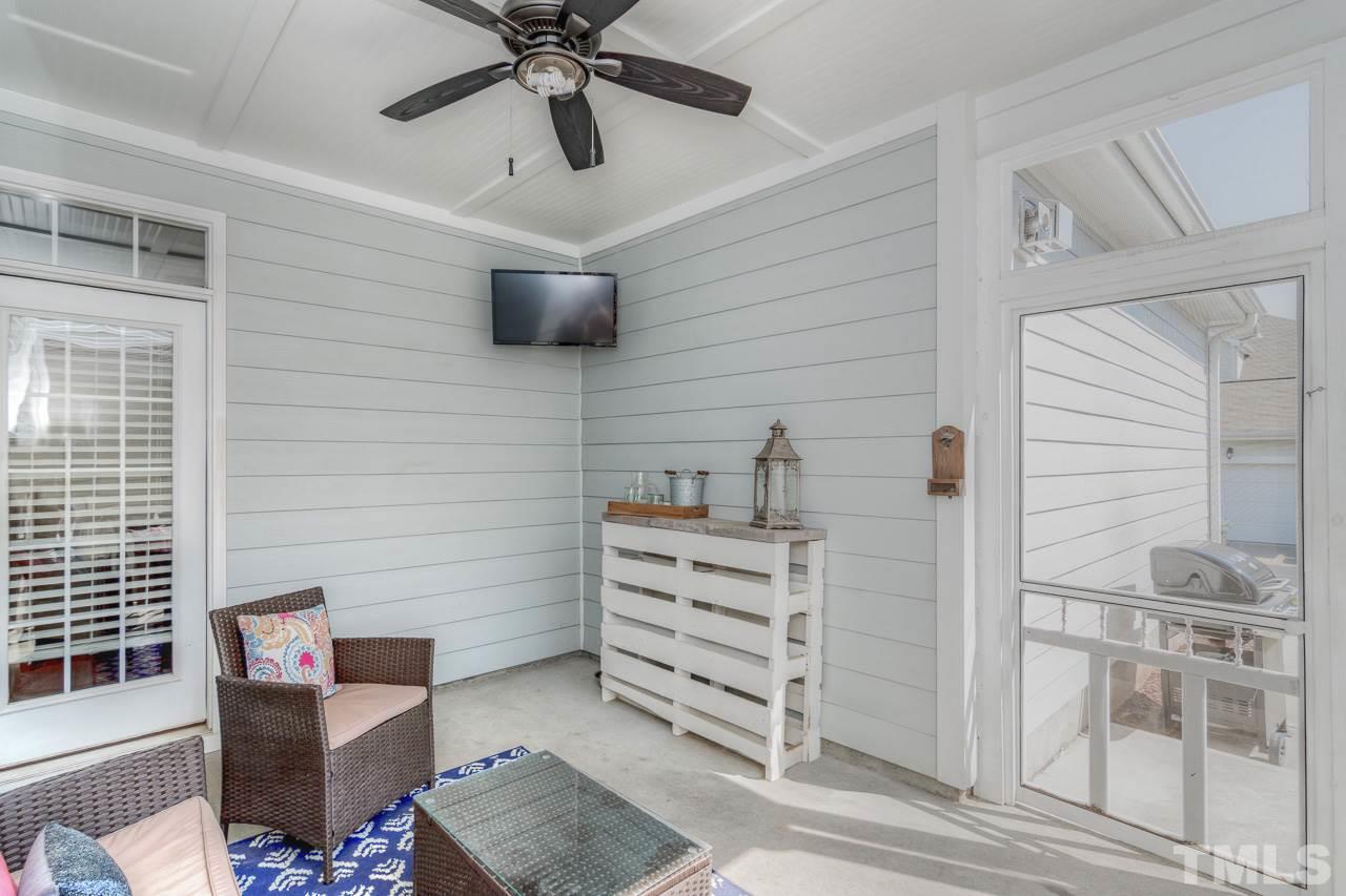 1141 Chapanoke Road Raleigh, NC 27603 - Photo 24 of 25 a view of a livingroom with furniture and a ceiling fan