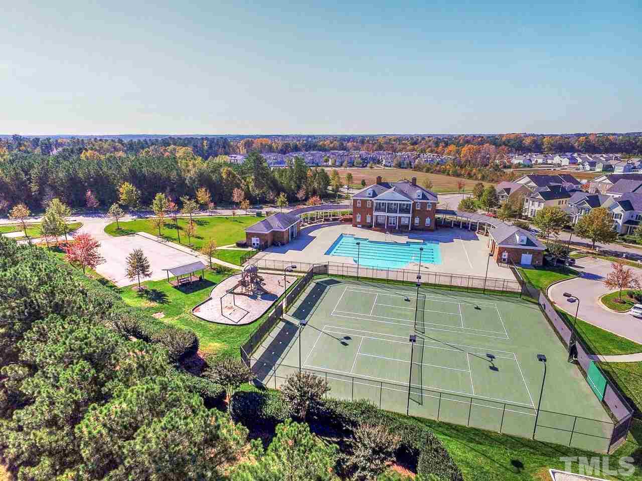 1141 Chapanoke Road Raleigh, NC 27603 - Photo 6 of 25 an aerial view of a house with swimming pool and outdoor seating