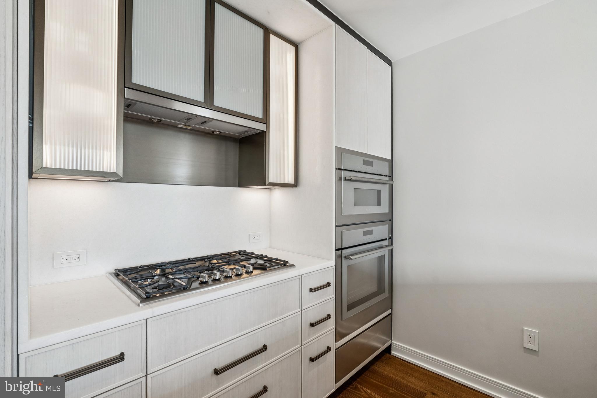 601 Wharf Street Southwest, Unit 504 Washington, DC 20024 - Photo 11 of 39 a kitchen with a stove and a refrigerator