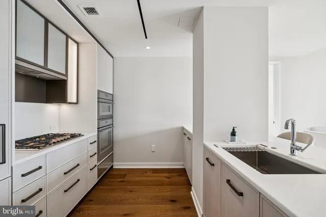 a kitchen with a stove and a refrigerator