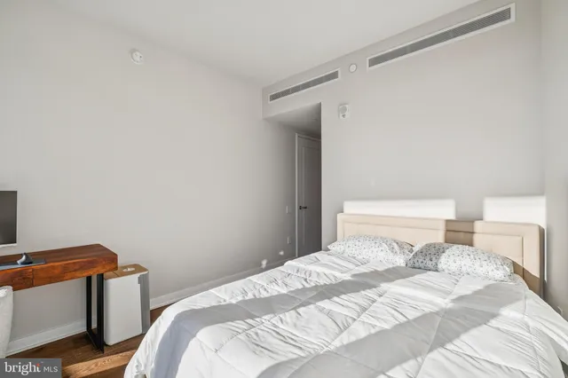 a view of walk in closet with clothes