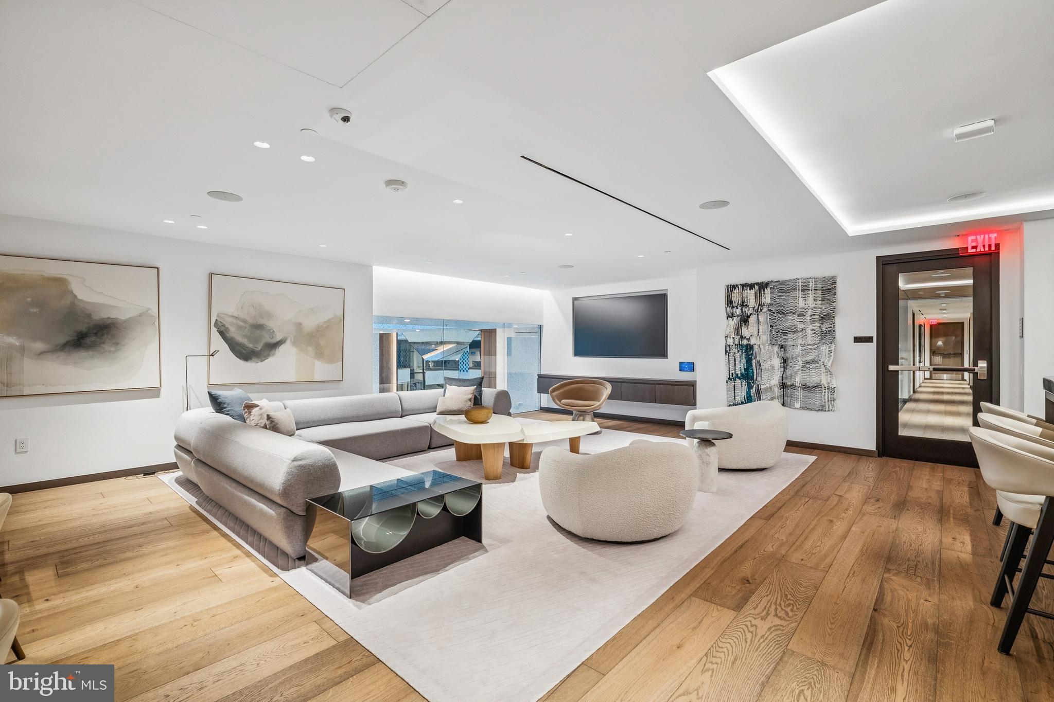 601 Wharf Street Southwest, Unit 504 Washington, DC 20024 - Photo 36 of 39 a living room with furniture and a flat screen tv