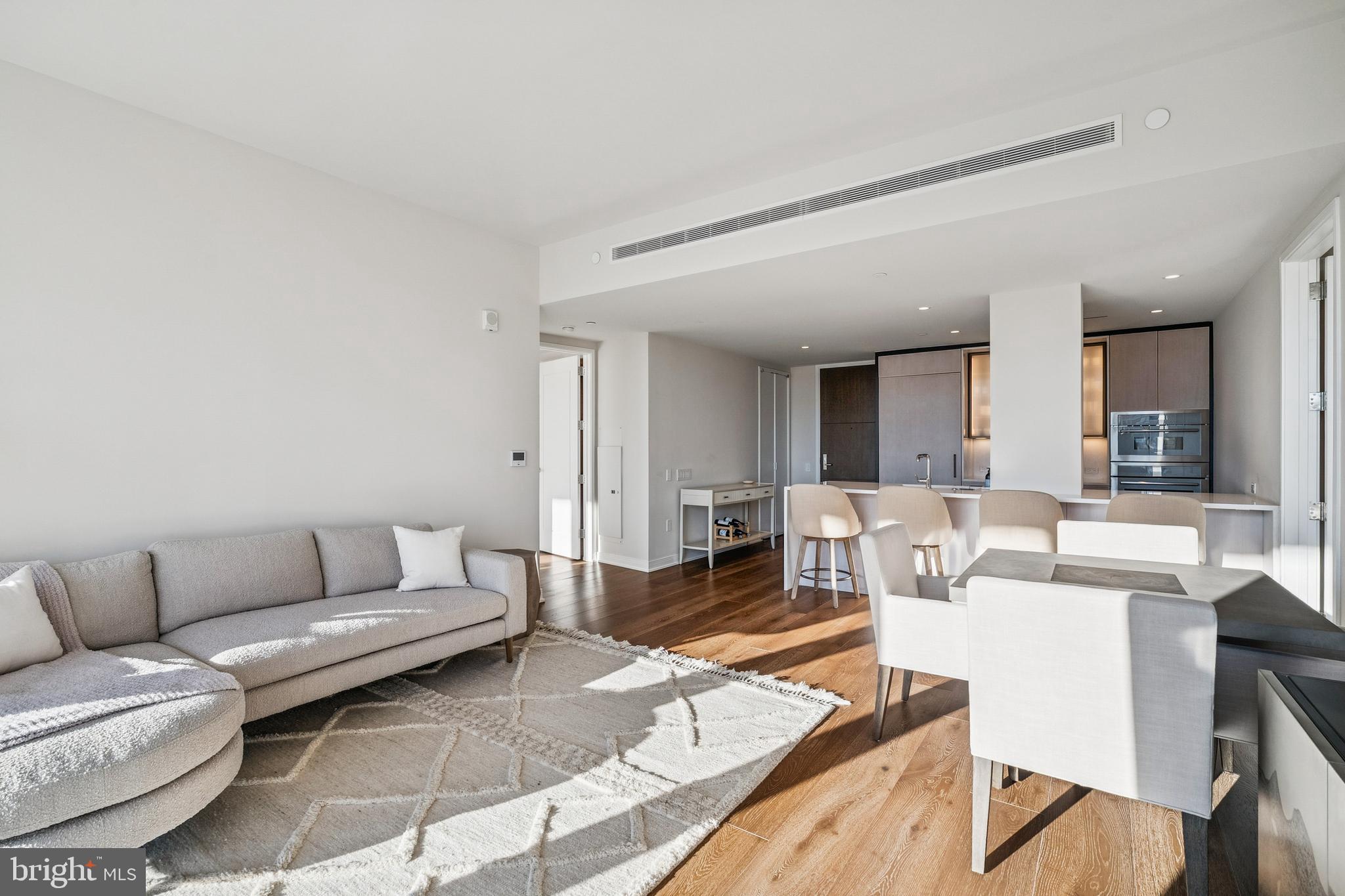 601 Wharf Street Southwest, Unit 504 Washington, DC 20024 - Photo 6 of 39 a living room with furniture and view of kitchen