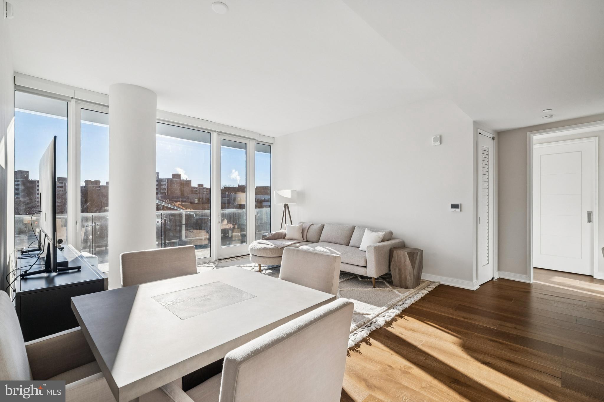 601 Wharf Street Southwest, Unit 504 Washington, DC 20024 - Photo 8 of 39 a living room with furniture and a window